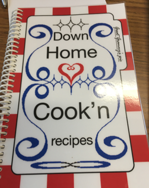 A flyer that has a picture and description of the cookbook that HMB Dollars for Scholars is selling.